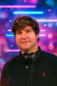 DJ Mat DJ Mat from One Night Only Music, wearing headphones and looking schweet.